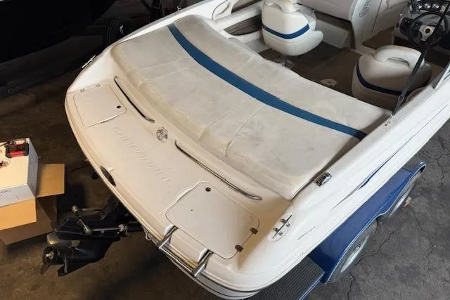 Slide: The Image of 2000 Chaparral 196 SSi boat interior with white and blue seating, viewed from the rear. - 5