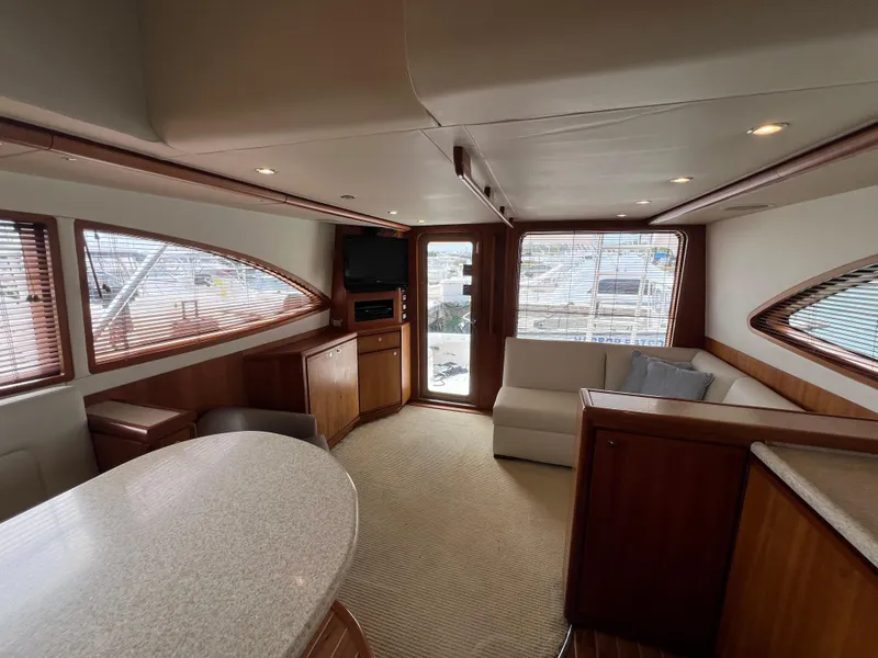 Slide: The Image of Luxurious interior of a 2009 Bertram Convertible yacht with elegant wood finishes. - 14