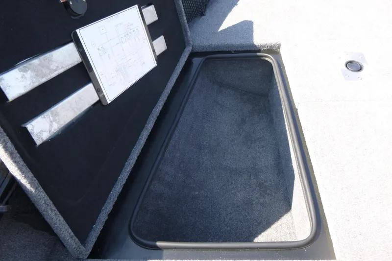 Slide: The Image of 2022 Ranger VS1882SC Angler boat storage compartment with open lid and interior view. - 11