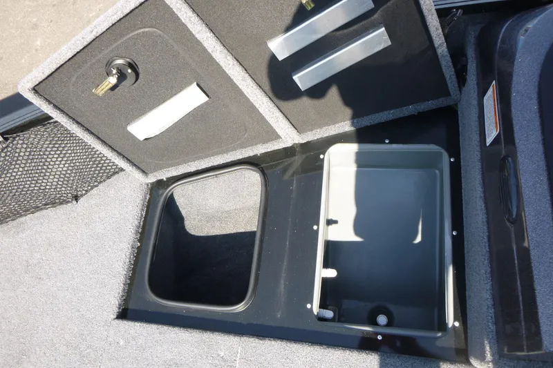 Slide: The Image of 2022 Ranger VS1882SC Angler boat storage compartments with secure locks and organized interior. - 12