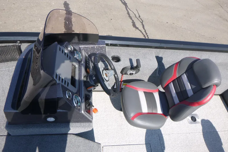 Slide: The Image of 2022 Ranger VS1882SC Angler boat interior with steering console and cushioned seat. - 7