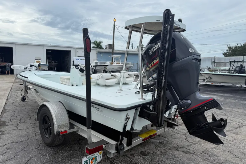 Slide: The Image of 2005 Maverick 18 HPX-V boat on trailer with Yamaha outboard motor, parked outdoors. - 10