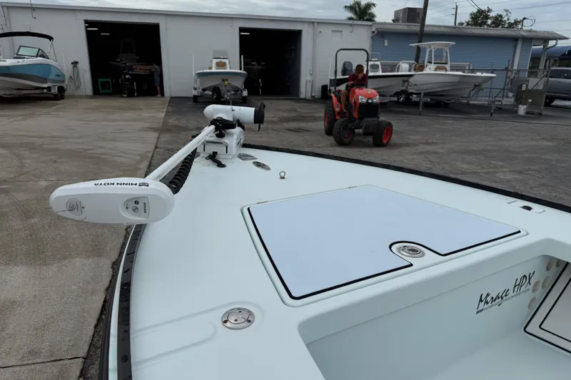 Slide: The Image of 2005 Maverick 18 HPX-V boat with Minn Kota motor at a marina storage area. - 13