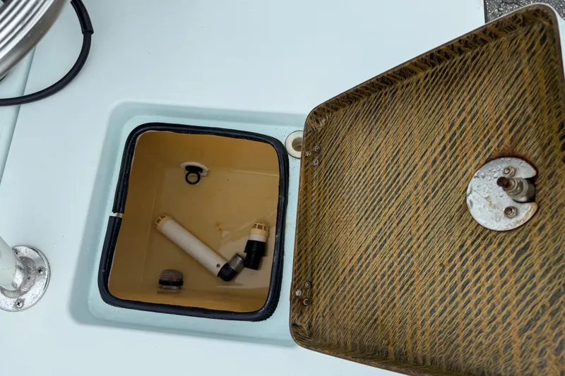 Slide: The Image of Open hatch on 2005 Maverick 18 HPX-V boat showing internal compartment and components. - 16