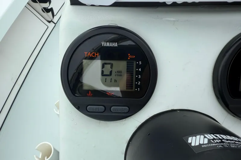 Slide: The Image of Yamaha tachometer on 2005 Maverick 18 HPX-V boat dashboard, displaying zero RPM. - 17