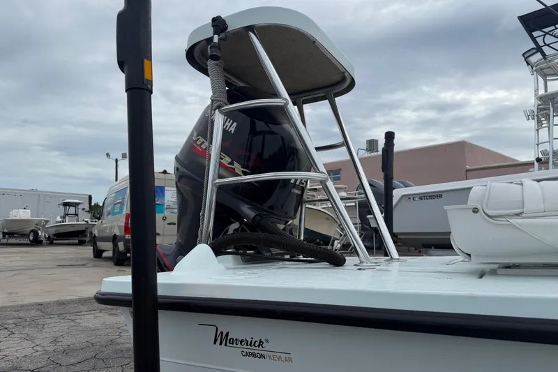 Slide: The Image of 2005 Maverick 18 HPX-V boat with Yamaha engine, parked outdoors under cloudy sky. - 7