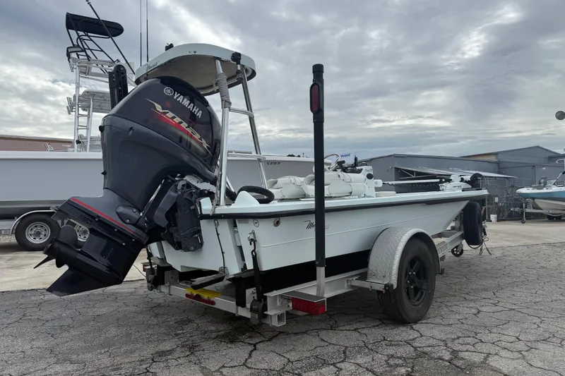 Slide: The Image of 2005 Maverick 18 HPX-V boat with Yamaha outboard motor on trailer, parked outdoors. - 8