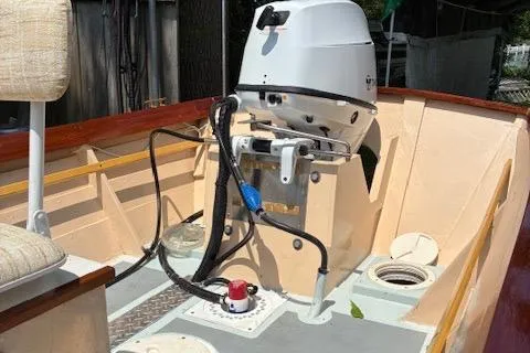 Slide: The Image of 2009 Simmons Sea Skiff 18 boat interior with motor and seating. - 10