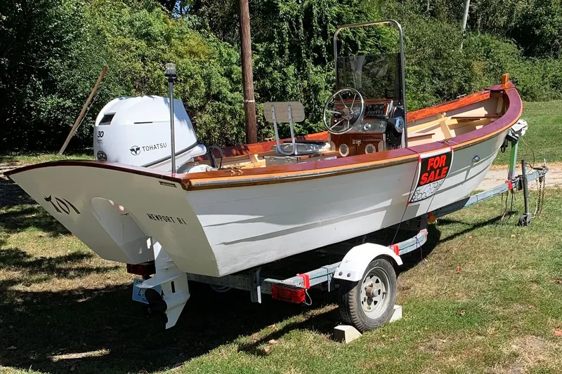 Slide: The Image of 2009 Simmons Sea Skiff 18 boat for sale on trailer, featuring Tohatsu engine. - 5