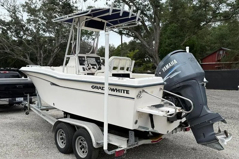Slide: The Image of 2005 Grady-White Escape 209 boat on trailer with Yamaha outboard motor. - 1
