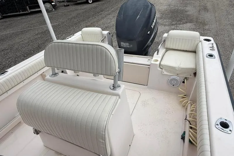 Slide: The Image of 2005 Grady-White Escape 209 boat interior with seating and Yamaha outboard motor. - 11