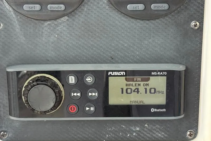 Slide: The Image of Fusion MS-RA70 radio on Grady-White Escape 209, tuned to 104.10 MHz FM. - 19