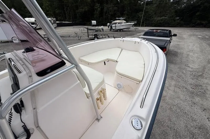 Slide: The Image of 2005 Grady-White Escape 209 boat interior with seating, parked on gravel lot. - 25