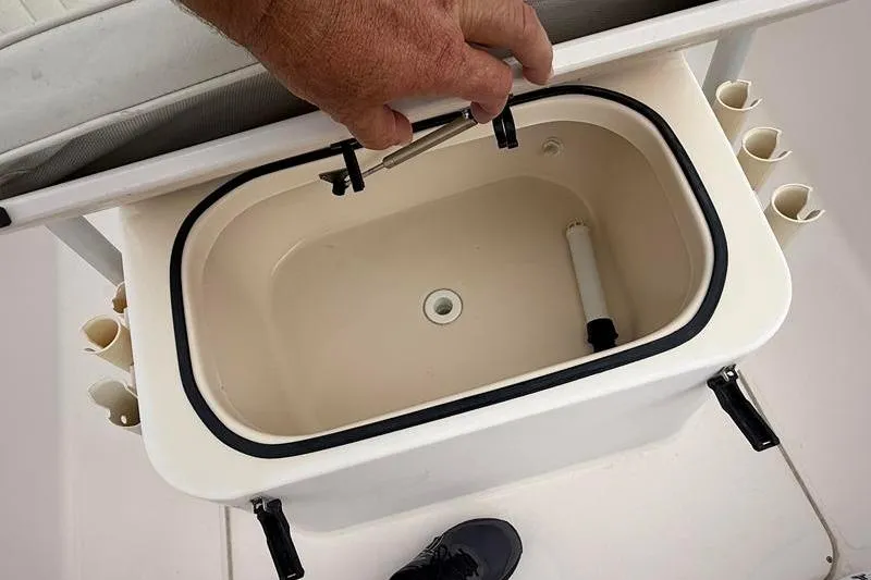 Slide: The Image of Livewell compartment on a 2005 Grady-White Escape 209 boat, open lid view. - 28