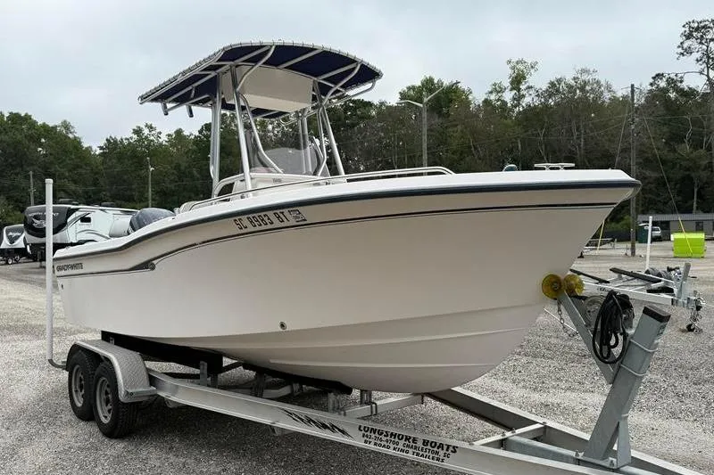 Slide: The Image of 2005 Grady-White Escape 209 boat on trailer, parked outdoors. - 5