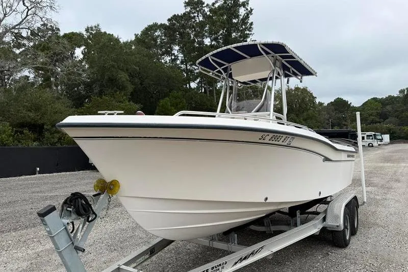 Slide: The Image of 2005 Grady-White Escape 209 boat on trailer, parked outdoors. - 6