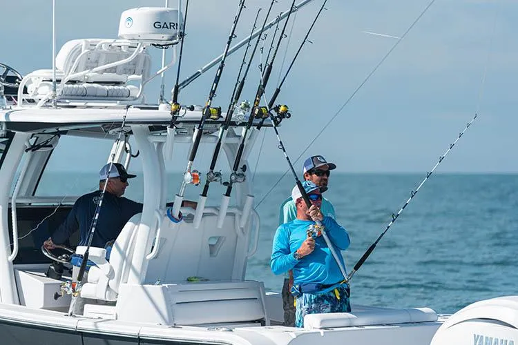 Slide: The Image of Manufacturer Provided Image: 2025 Sportsman Open 322 Center Console with anglers fishing at sea. - 7