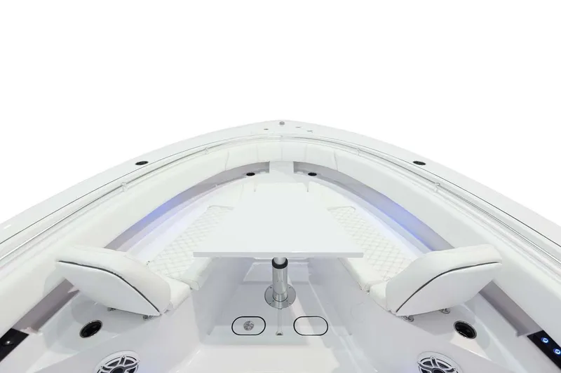 Slide: The Image of Manufacturer Provided Image: 2025 Sportsman Open 322 Center Console boat interior with seating and table. - 8