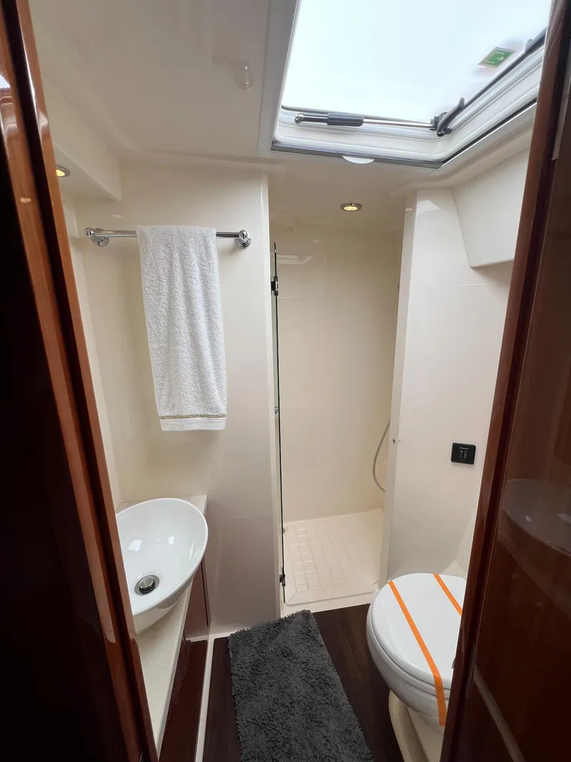 Slide: The Image of Bathroom interior of 2016 Riviera 45 OPEN yacht with skylight and modern fixtures. - 18
