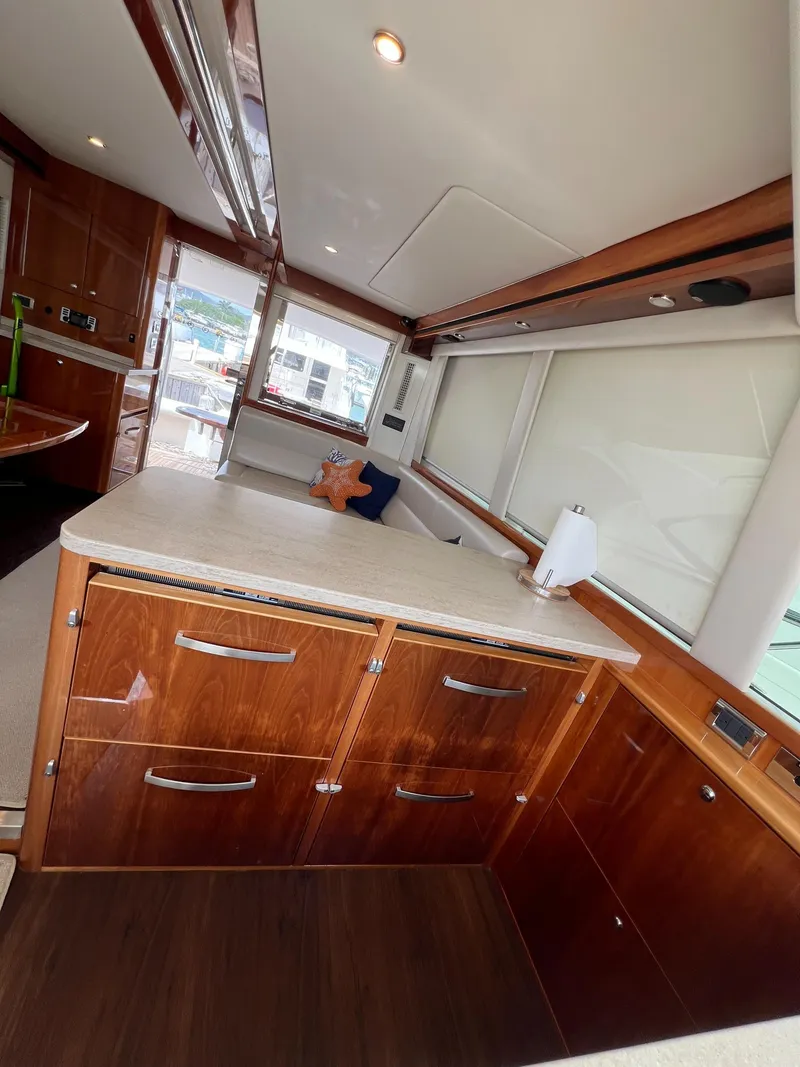 Slide: The Image of Interior of 2016 Riviera 45 OPEN yacht with wooden cabinetry and modern design. - 9