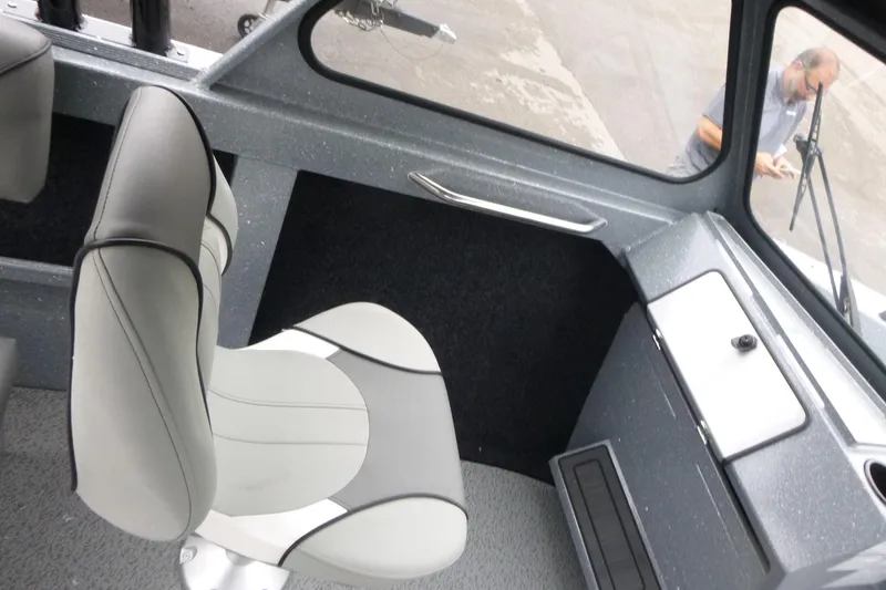 Slide: The Image of Interior of 2026 KingFisher 2025 Escape boat with modern seating and dashboard. - 11