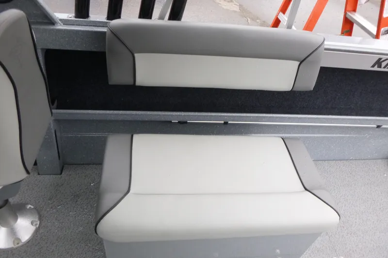Slide: The Image of Interior seating of 2026 KingFisher 2025 Escape boat, featuring gray and white upholstery. - 13