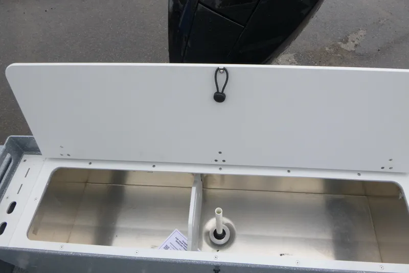 Slide: The Image of Open storage compartment in 2026 KingFisher 2025 Escape boat, featuring a sleek design. - 17