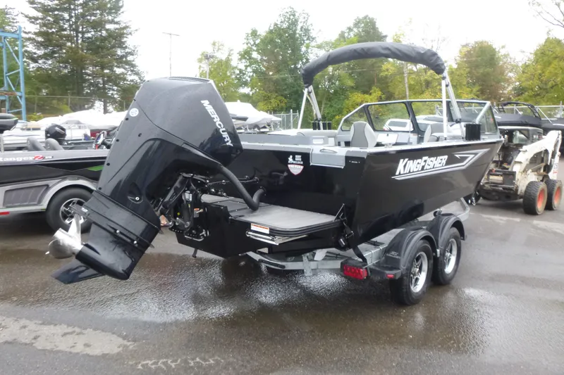 Slide: The Image of KingFisher 2025 Escape boat, 2026 model, on trailer with Mercury outboard motor. - 3