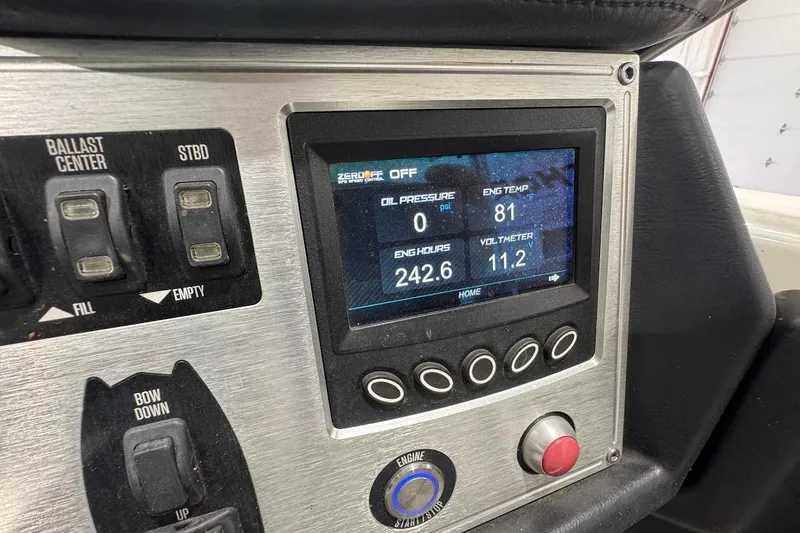 Slide: The Image of Dashboard of a 2016 MasterCraft NXT22 boat showing engine metrics and ballast controls. - 12