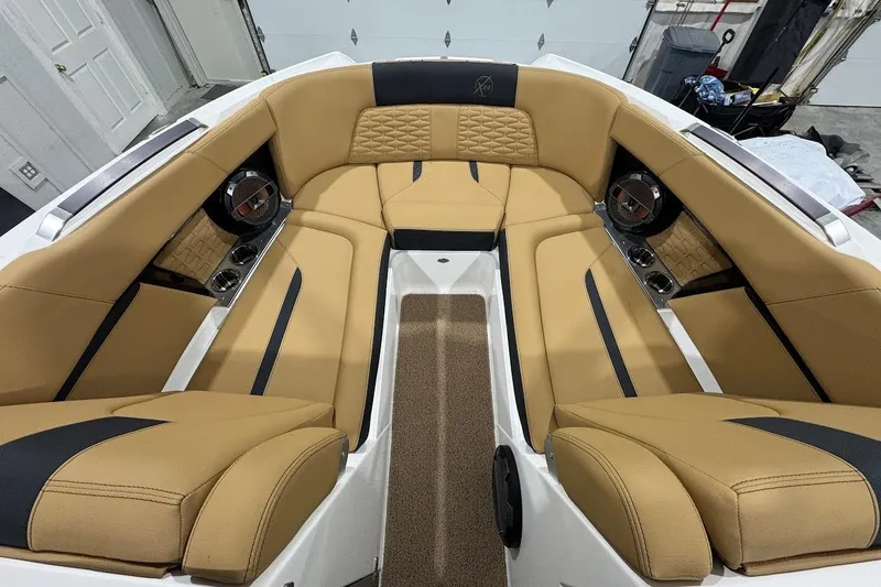Slide: The Image of Luxurious interior of 2021 MasterCraft X24 boat with tan and black seating. - 15