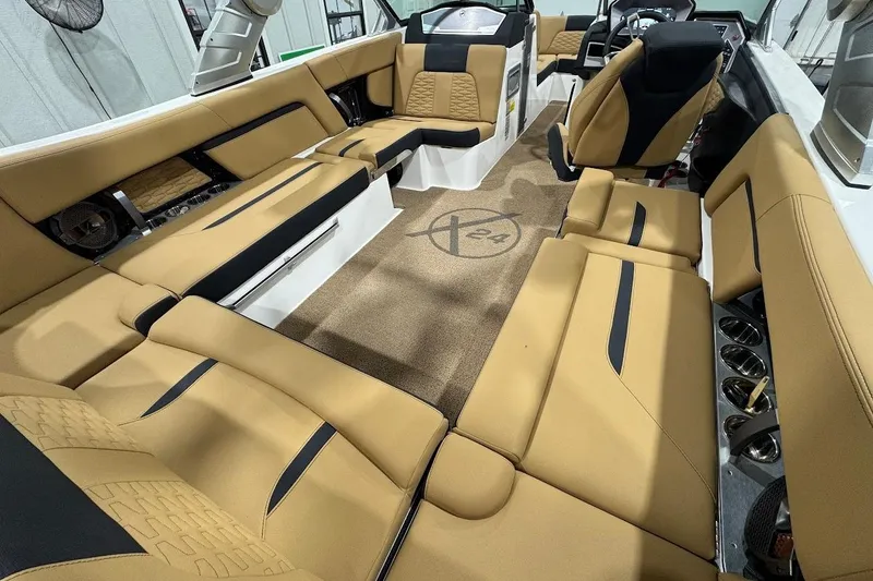 Slide: The Image of Luxurious interior of 2021 MasterCraft X24 boat with tan and black seating. - 9