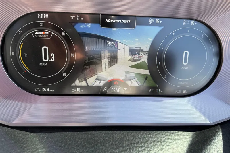 Slide: The Image of 2023 MasterCraft XT24 dashboard display showing speed, RPM, and camera view. - 17