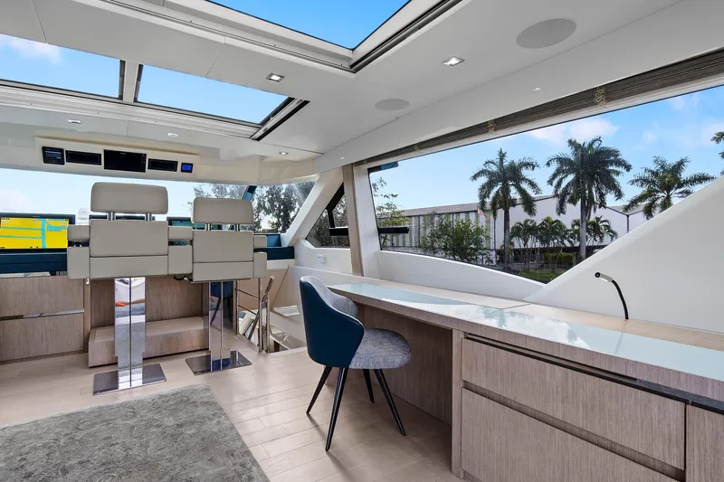 Slide: The Image of Luxurious interior of 2021 Monte Carlo Yachts MCY 76 Skylounge with panoramic windows and modern furnishings. - 14