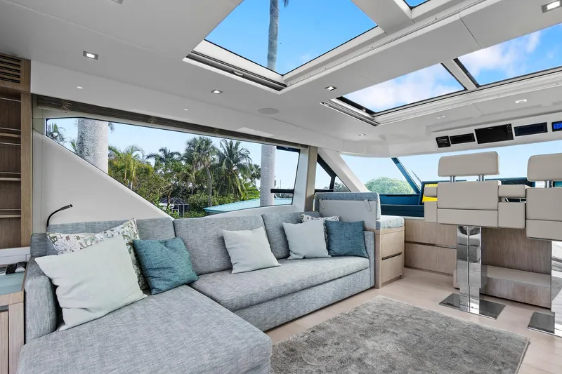 Slide: The Image of Luxurious interior of 2021 Monte Carlo Yachts MCY 76 Skylounge with modern seating and skylights. - 16