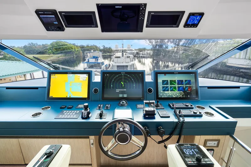 Slide: The Image of Cockpit of 2021 Monte Carlo Yachts MCY 76 Skylounge with advanced navigation systems. - 17