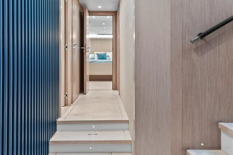Slide: The Image of Interior hallway of 2021 Monte Carlo Yachts MCY 76 Skylounge, featuring modern design and lighting. - 24