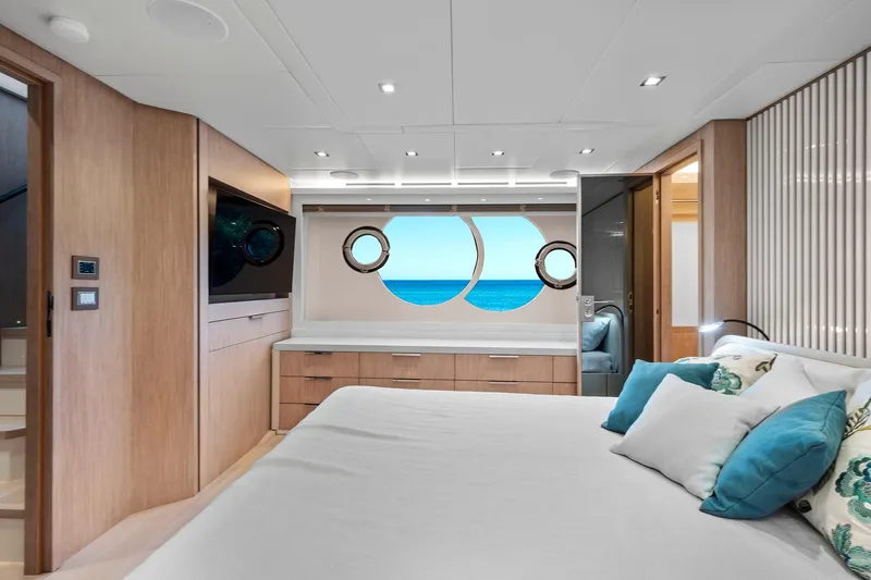 Slide: The Image of Luxurious bedroom interior of 2021 Monte Carlo Yachts MCY 76 Skylounge with ocean view. - 26