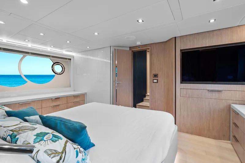 Slide: The Image of Luxurious bedroom in 2021 Monte Carlo Yachts MCY 76 Skylounge with ocean view. - 27