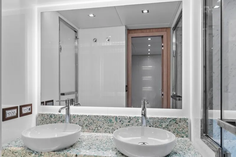 Slide: The Image of Luxurious bathroom in 2021 Monte Carlo Yachts MCY 76 Skylounge with dual sinks and modern design. - 29