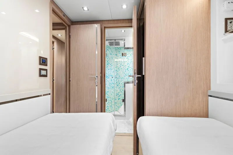 Slide: The Image of Luxurious cabin interior of 2021 Monte Carlo Yachts MCY 76 Skylounge with twin beds. - 33