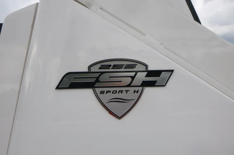 Slide: The Image of 2026 Yamaha Boats 255 FSH Sport H logo on white surface. - 19