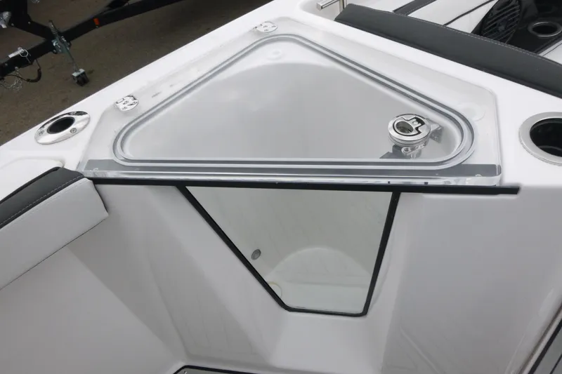 Slide: The Image of 2026 Yamaha Boats 255 FSH Sport H, featuring a sleek storage compartment with secure latch. - 9