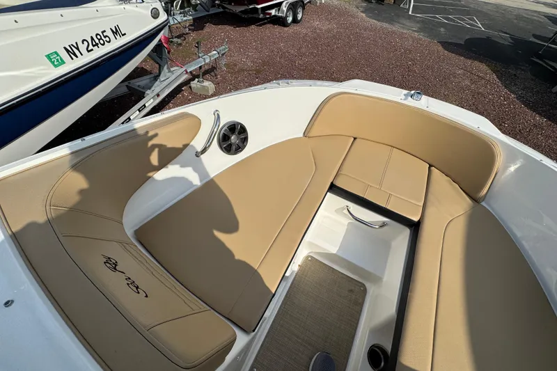 Slide: The Image of 2021 Sea Ray SPX 190 Outboard boat with tan seating and sleek interior design. - 17
