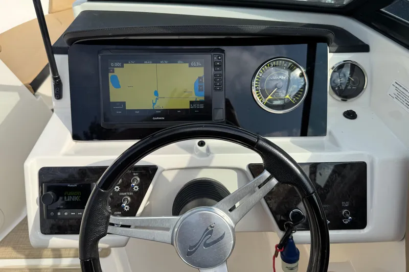 Slide: The Image of Steering console of 2021 Sea Ray SPX 190 Outboard with Garmin navigation display. - 4
