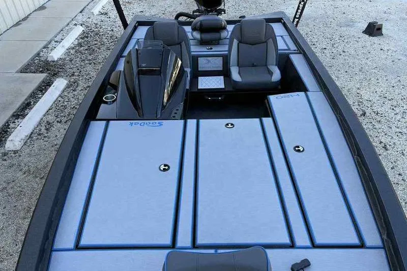 Slide: The Image of 2026 Xpress H20 Bass boat interior with sleek seating and storage compartments. - 13