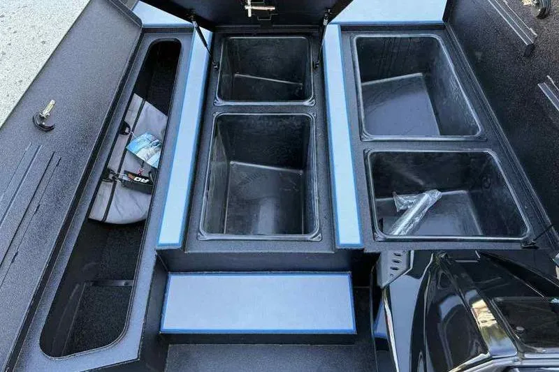 Slide: The Image of 2026 Xpress H20 Bass boat storage compartments with open lids, showcasing ample space. - 14