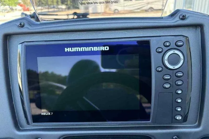 Slide: The Image of Humminbird Helix 7 fish finder on 2026 Xpress H20 Bass boat dashboard. - 2