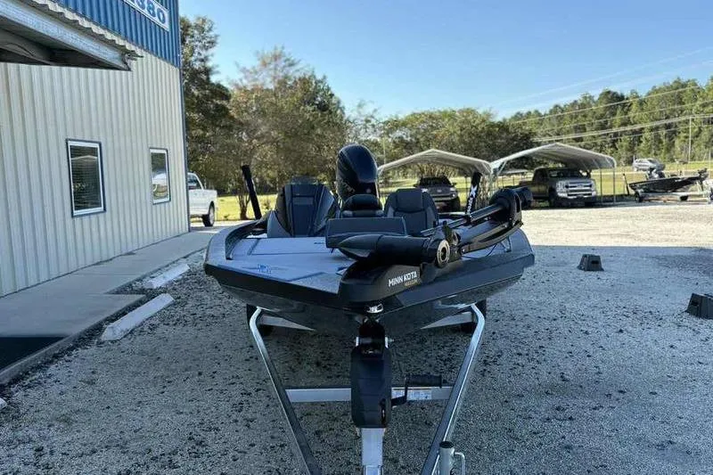 Slide: The Image of 2026 Xpress H20 Bass boat on trailer, parked outside dealership. - 5