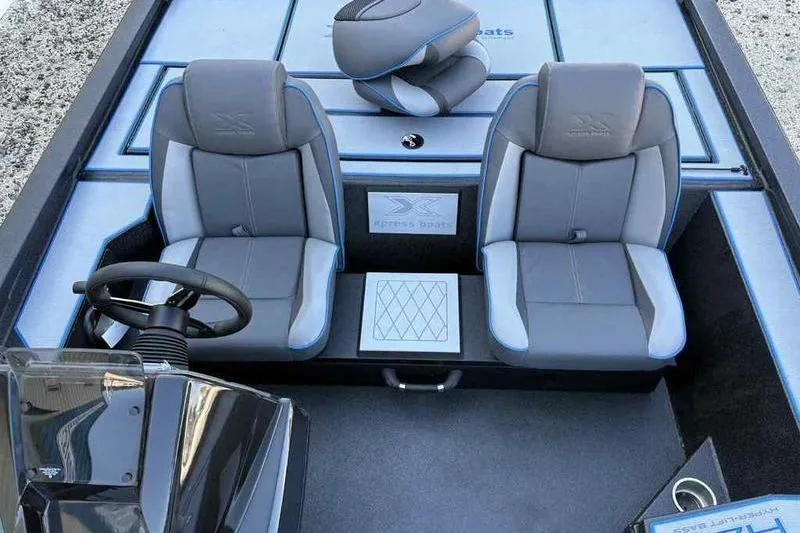 Slide: The Image of 2026 Xpress H20 Bass boat interior with dual gray seats and steering console. - 8