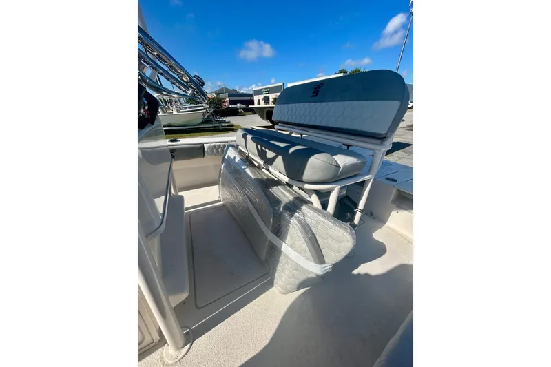 Slide: The Image of 2026 Carolina Skiff 22 Ultra Elite boat interior with cushioned seating. - 6